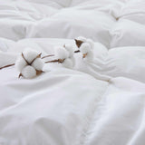 Experience timeless comfort with our White Organic Cotton Down Comforter — a must-have for those who value clean, classic bedding. Crafted from GOTS-certified organic cotton and filled with 100% down and feather fiber, this breathable and lightweight comforter is perfect for all-season use. The crisp white color creates a fresh, hotel-quality look while offering unmatched softness and natural temperature regulation. Whether styled alone or layered with other bedding, this white comforter elevates any bedroo