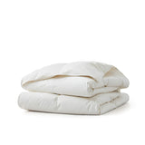 Classic and elegant, the White organic cotton comforter offers a crisp, clean look that suits any bedroom style. Lightweight and breathable, it's ideal for hot sleepers or as a versatile layering piece year-round.