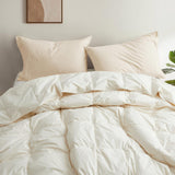 The lightest weight down comforter with feathers is covered in crisp tones of off white. Add a touch of contemporary finesse to your bedroom or bedding option with this off-white cover feather down comforter.