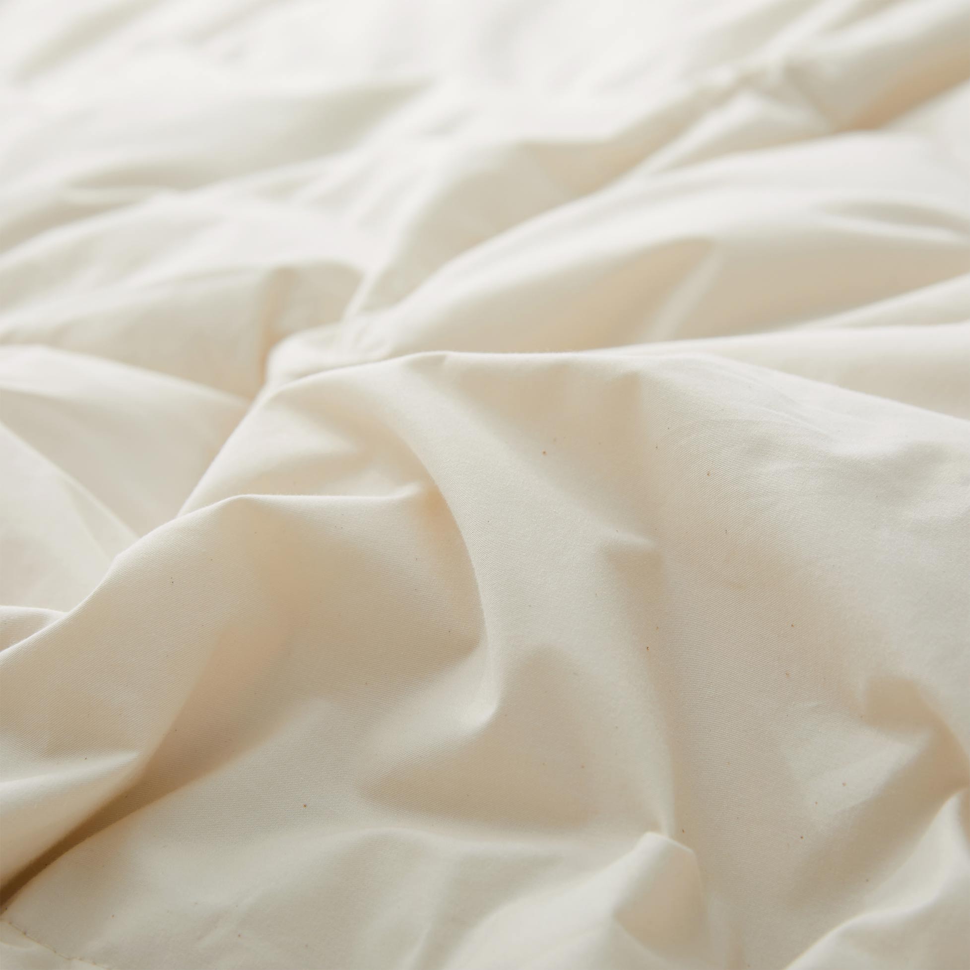 The lightest weight down comforter with feathers is covered in crisp tones of off white. Add a touch of contemporary finesse to your bedroom or bedding option with this off-white cover feather down comforter.