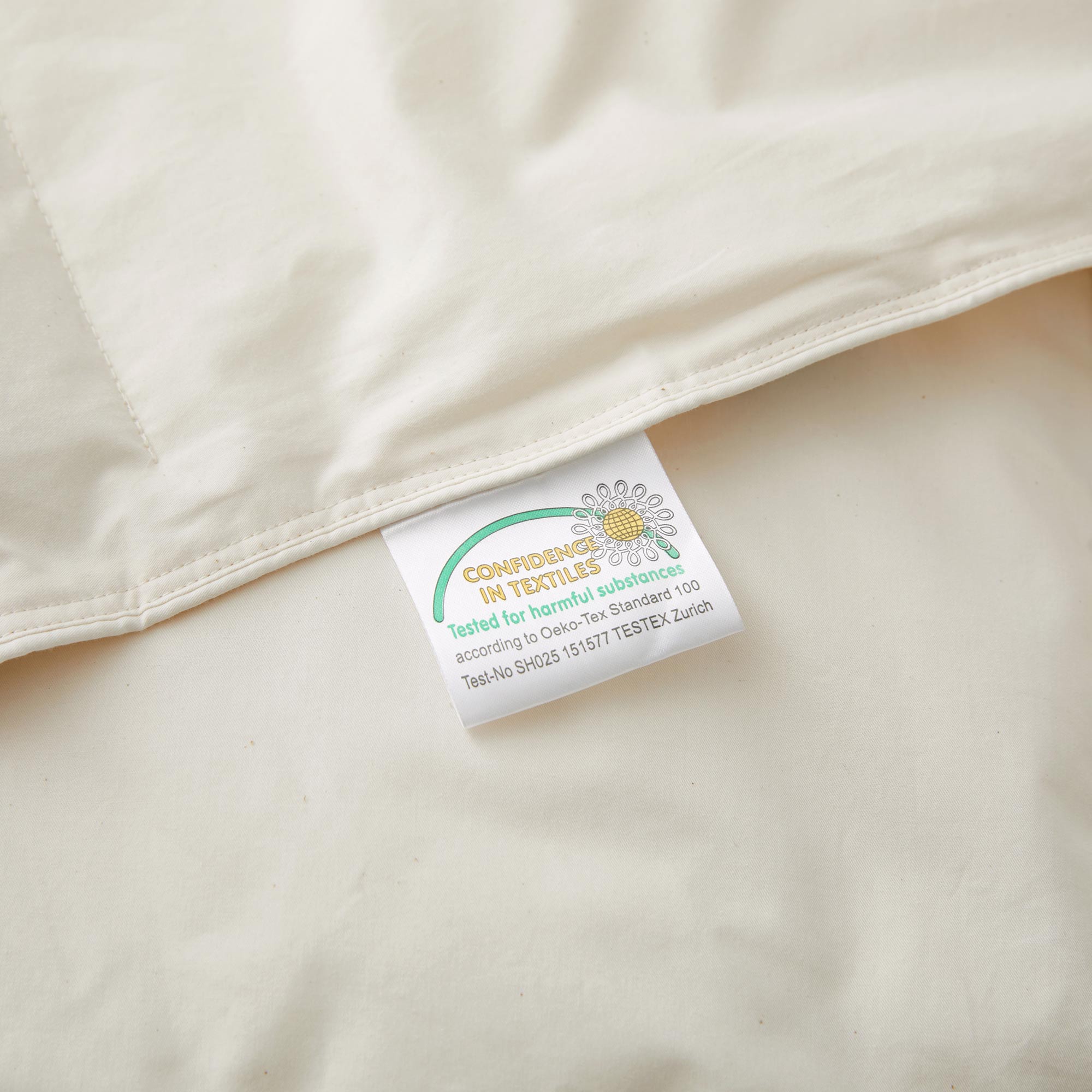 The lightest weight down comforter with feathers is covered in crisp tones of off white. Add a touch of contemporary finesse to your bedroom or bedding option with this off-white cover feather down comforter.