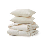 Elevate your sleep with the Lightweight Organic Cotton Down Comforter & Pillow Bundle, featuring a breathable 100% GOTS-certified organic cotton comforter and two matching down pillows. The lightweight design is perfect for warm sleepers and hot climates, offering cloud-like softness while remaining cool and breathable. Ethically sourced and machine washable, this bundle delivers natural comfort and premium quality at great value.