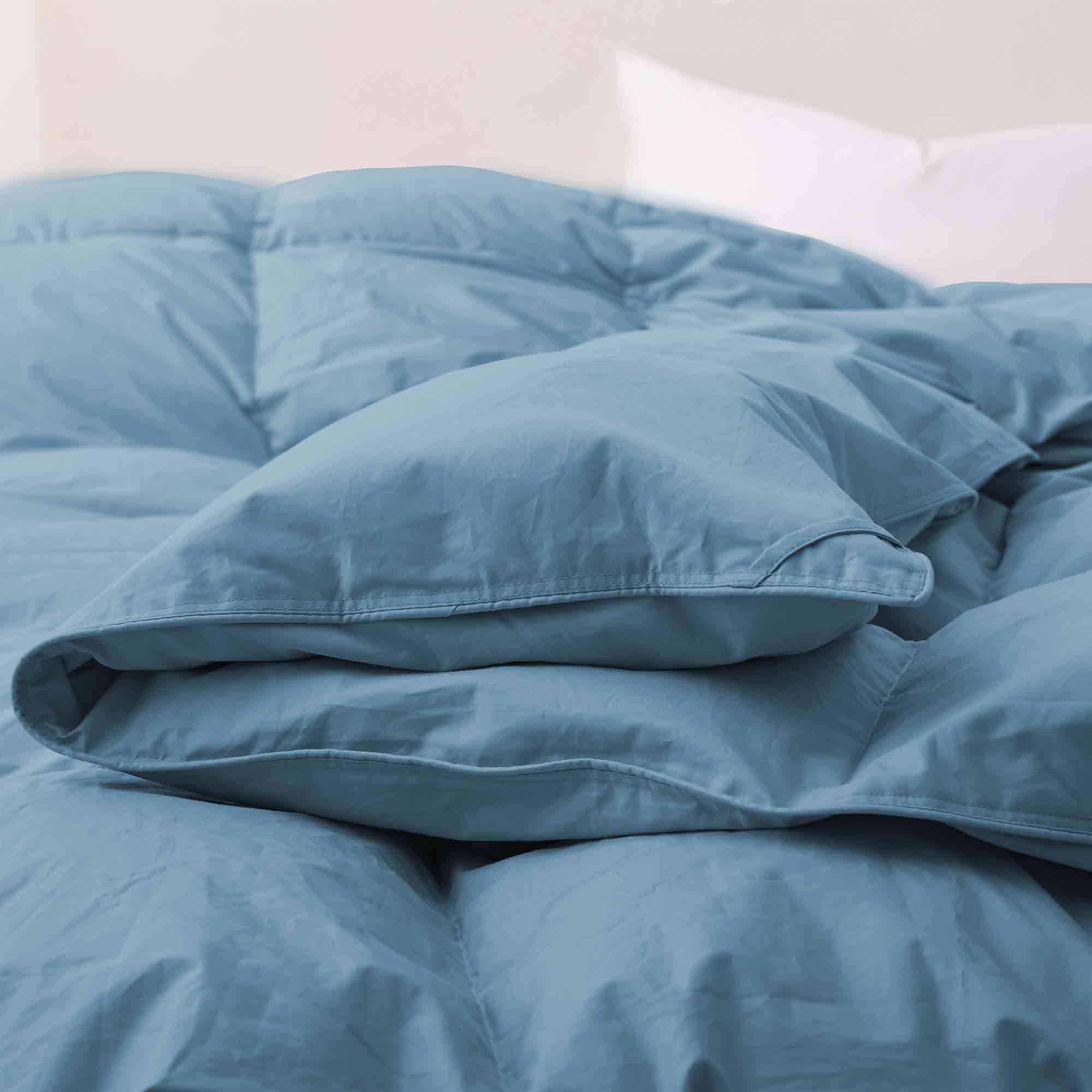 Elevate your sleep setup with our Castle Blue Organic Cotton Comforter, featuring a deep, rich blue hue that brings bold elegance to any bedroom. Made with GOTS-certified organic cotton and filled with down and feather fiber, this luxurious comforter offers breathable warmth and long-lasting comfort. Ideal for modern or dramatic interiors, the Castle Blue version is a statement piece that combines sustainable materials with sophisticated design