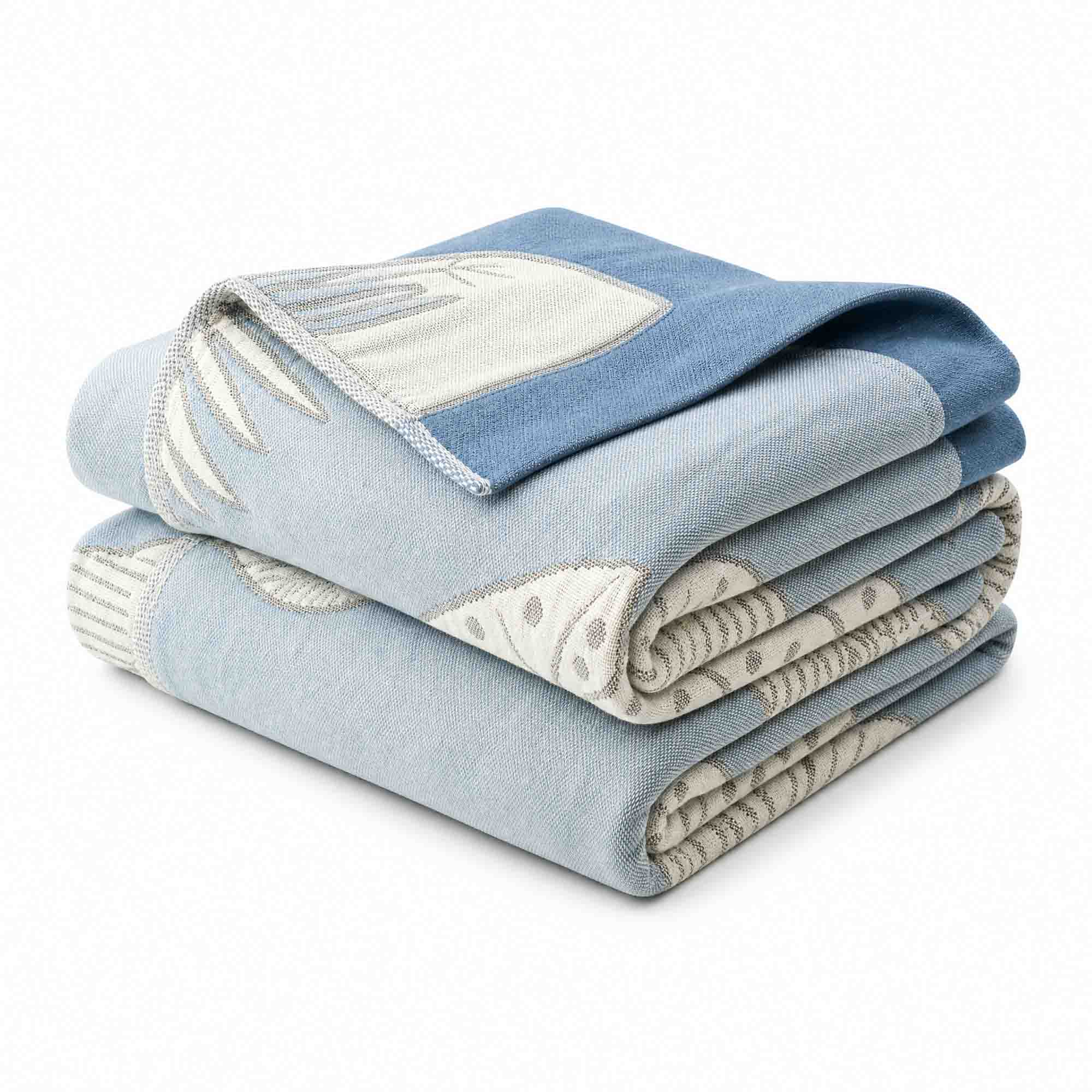 A folded Boho Cotton Throw Blanket in blue and cream with a nature-inspired jacquard pattern, displayed against a white background.