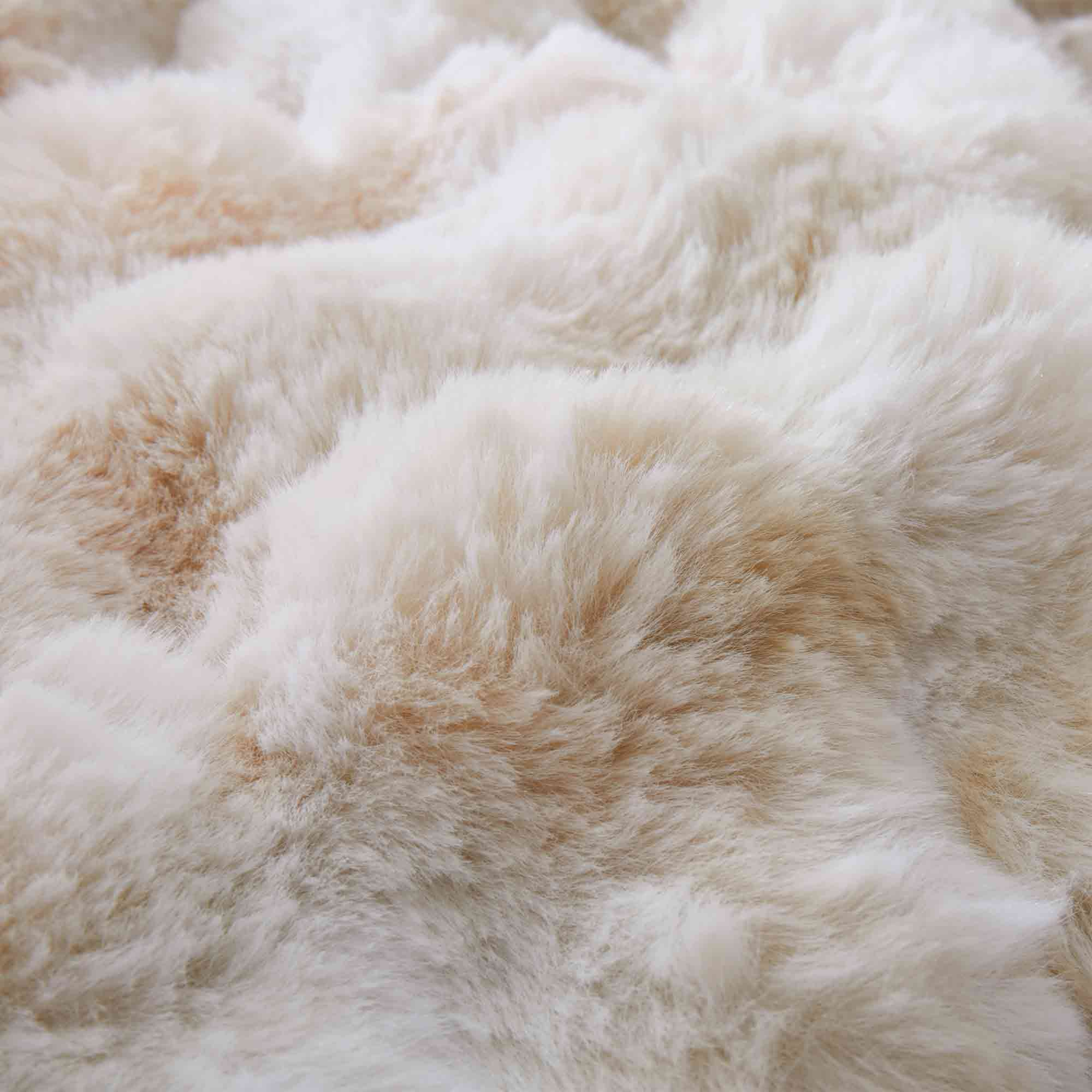 Brown faux rabbit fur comforter set styled with sherpa reverse and coordinating zip-closure pillow shams, offering a warm and elegant bedroom look.