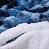 Navy faux rabbit fur comforter set featuring a reversible sherpa lining and pillow shams, adding a bold yet inviting touch to the bedroom.