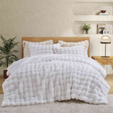 White faux rabbit fur comforter set with sherpa reverse and zip-closure pillow shams, creating a clean, timeless, and luxurious atmosphere.
