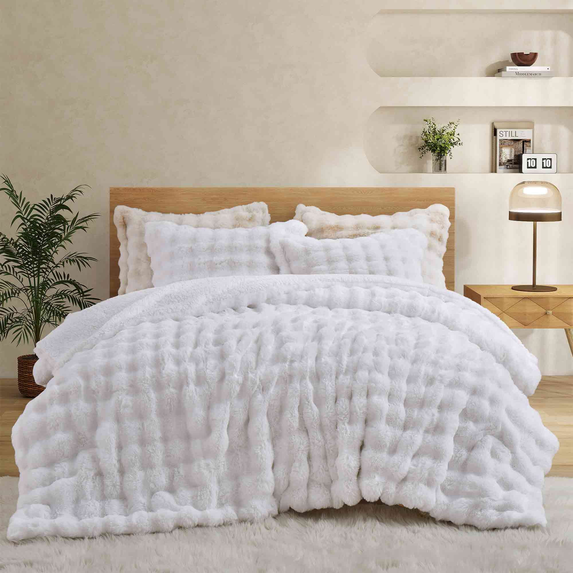 White faux rabbit fur comforter set with sherpa reverse and zip-closure pillow shams, creating a clean, timeless, and luxurious atmosphere.