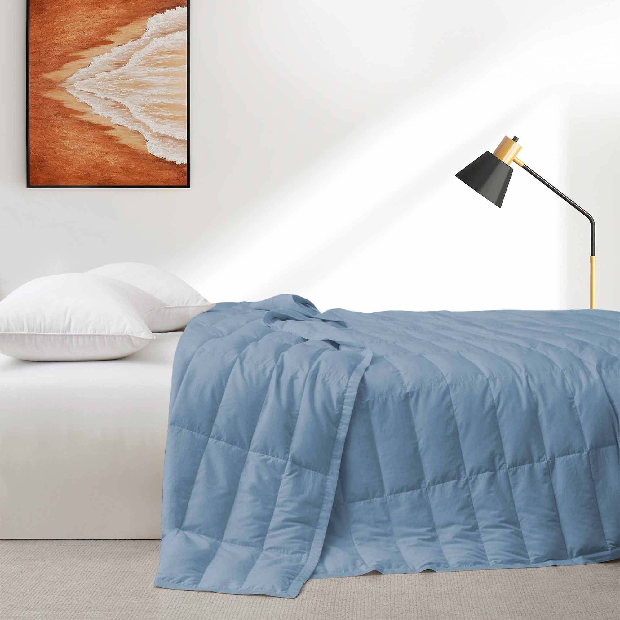The down blankets are brushed in the mineral blue hues of rock. Provoke feelings of stability and calmness in your space with this down blanket in Rock Blue.