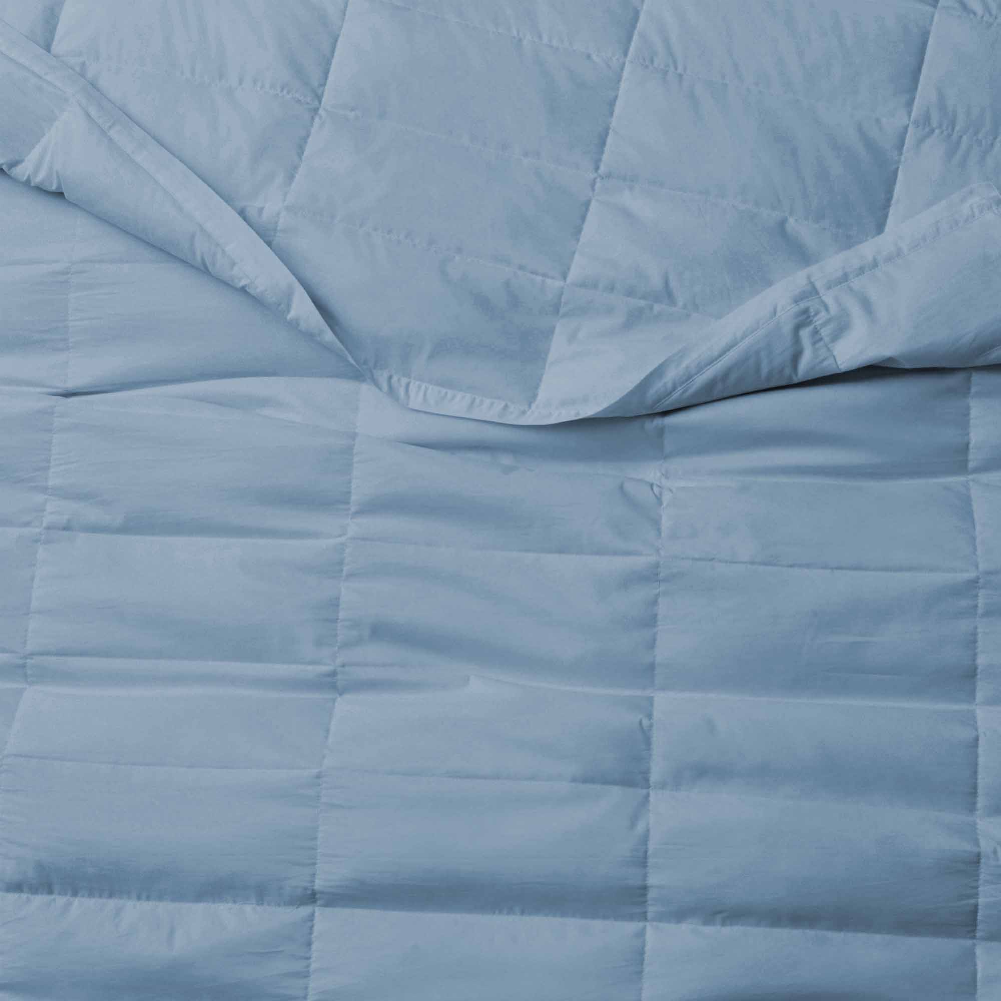 The down blankets are brushed in the mineral blue hues of rock. Provoke feelings of stability and calmness in your space with this down blanket in Rock Blue.