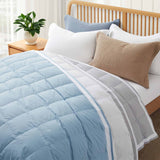 The feather down comforter blanket is enveloped in the airy tones of sky blue with a contrasting white trim. Enhance your bedding with the beauty of the skies with this summer season comforter in sky blue.