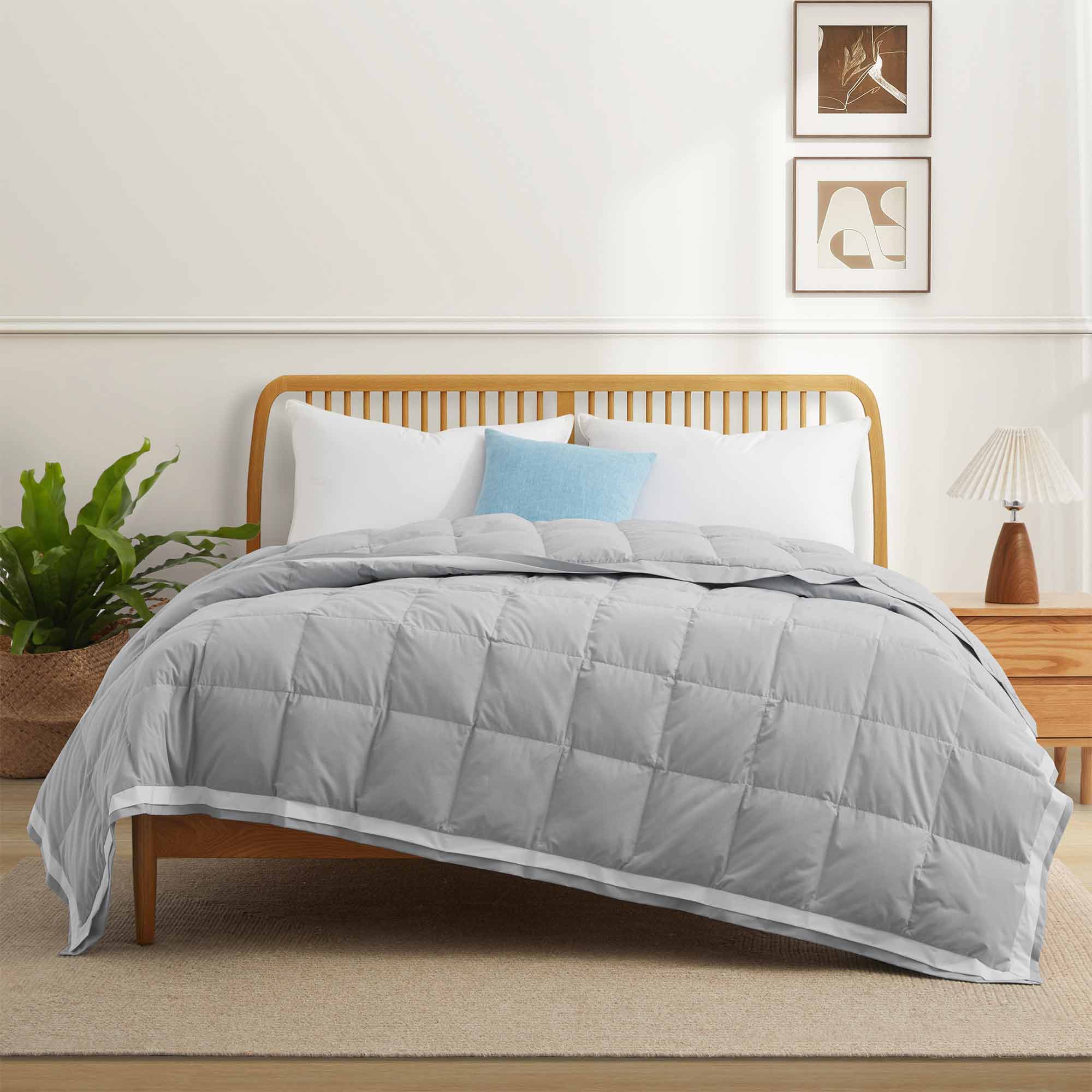 The summer cooling blanket is covered in the somber hues of gray with a complementing white trim. Bring refreshing sophistication to your personal space with this down duvet insert in gray.