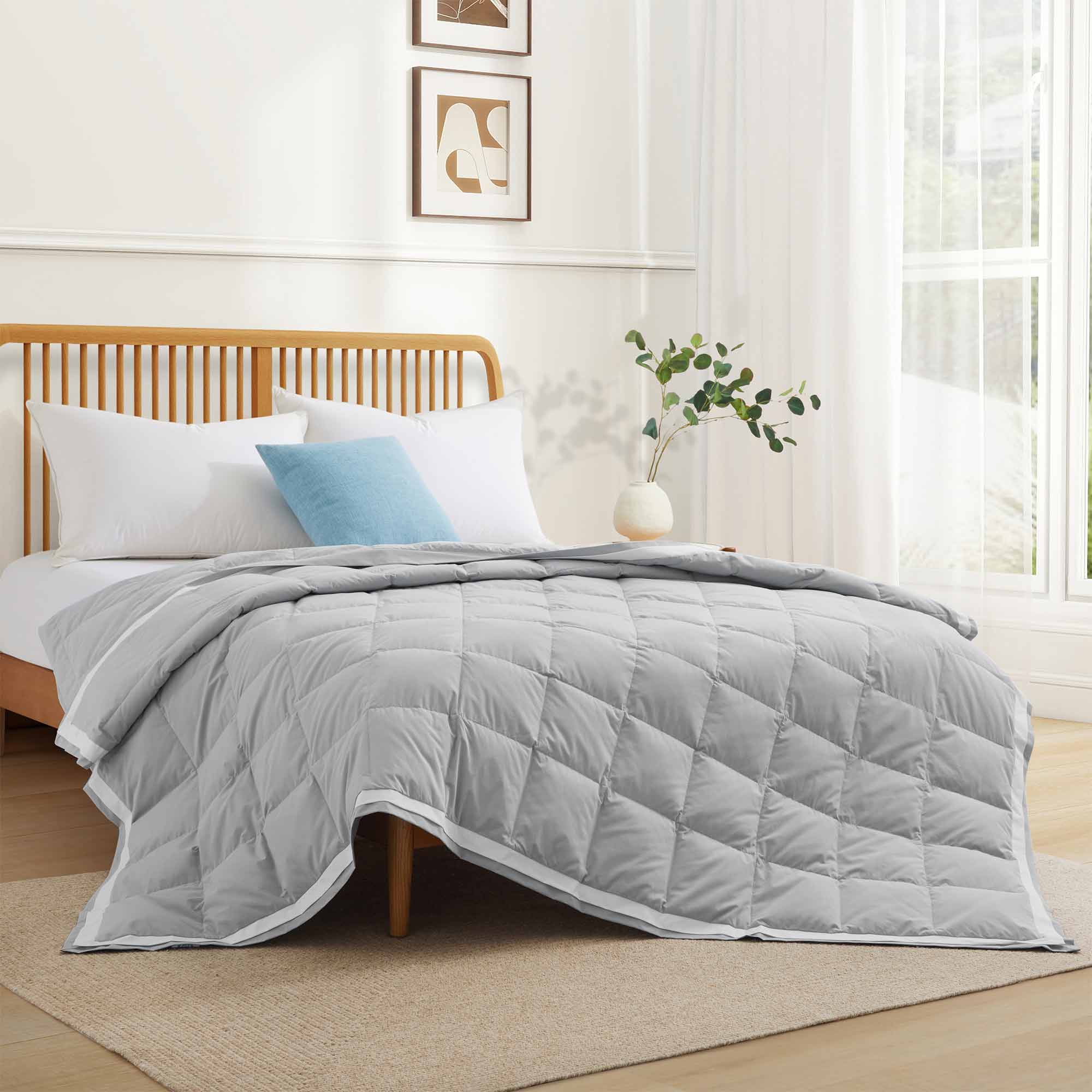 The summer cooling blanket is covered in the somber hues of gray with a complementing white trim. Bring refreshing sophistication to your personal space with this down duvet insert in gray.