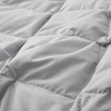 The summer cooling blanket is covered in the somber hues of gray with a complementing white trim. Bring refreshing sophistication to your personal space with this down duvet insert in gray.