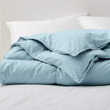 The down comforter with feathers is enveloped in the pristine shades of Sky Blue. Enjoy a cloud-like experience for a cozy sleep with this superior quality down feather comforter with duvet ties.