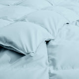 The down comforter with feathers is enveloped in the pristine shades of Sky Blue. Enjoy a cloud-like experience for a cozy sleep with this superior quality down feather comforter with duvet ties.