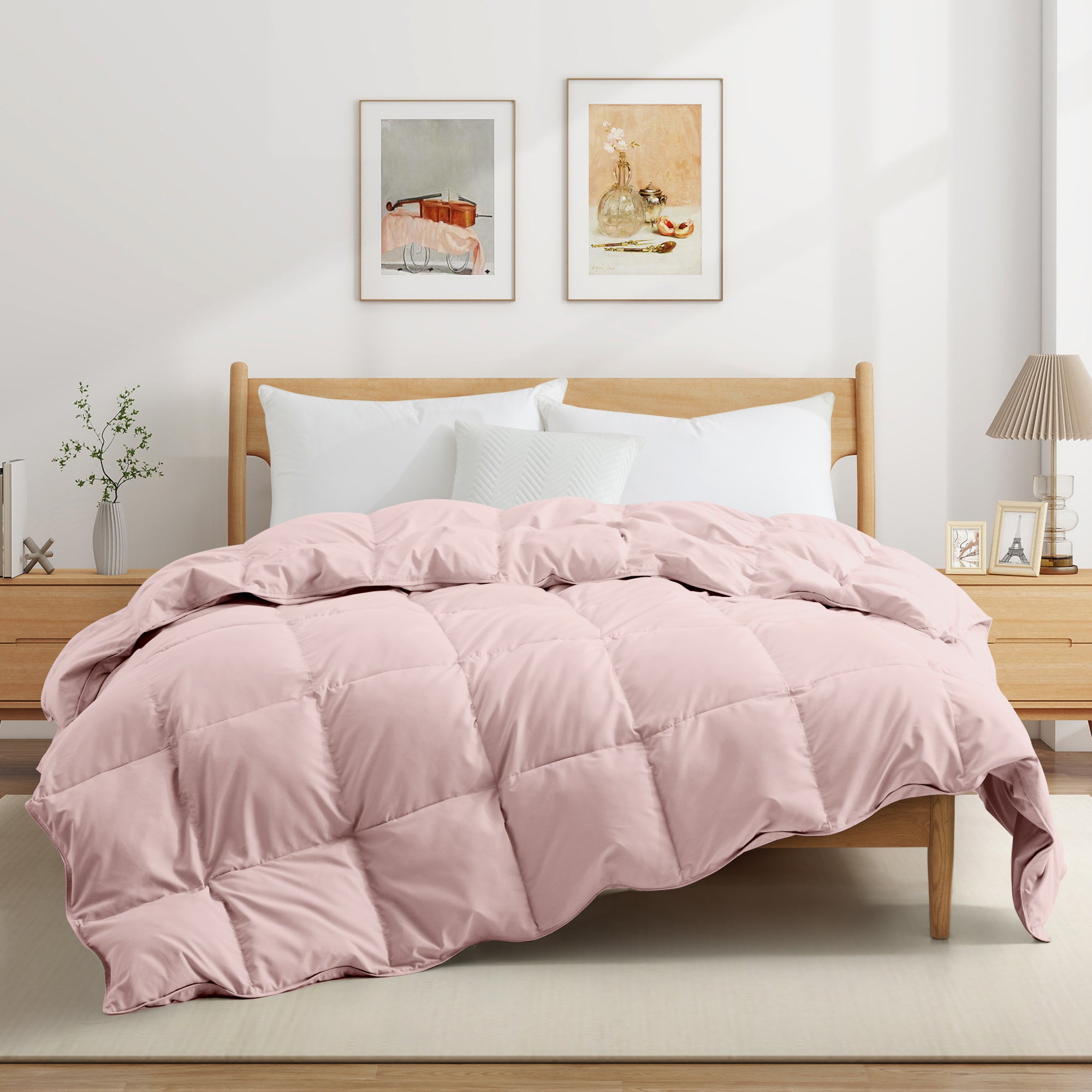 The feather goose down comforter is available in the feminine tones of Pink. Enjoy balanced year-round warmth with this feather goose down comforter.