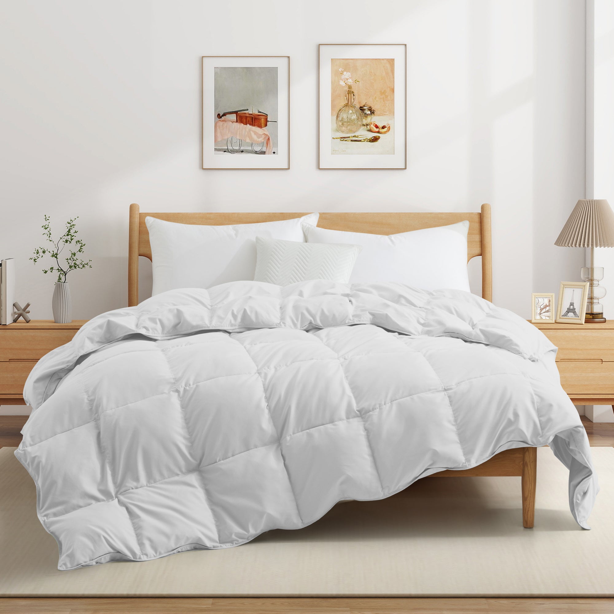 Fresh white tones are brushed over the all-size comforter. Add a touch of all-around luxurious warmth to your modern bedroom design with this down comforter with feathers.