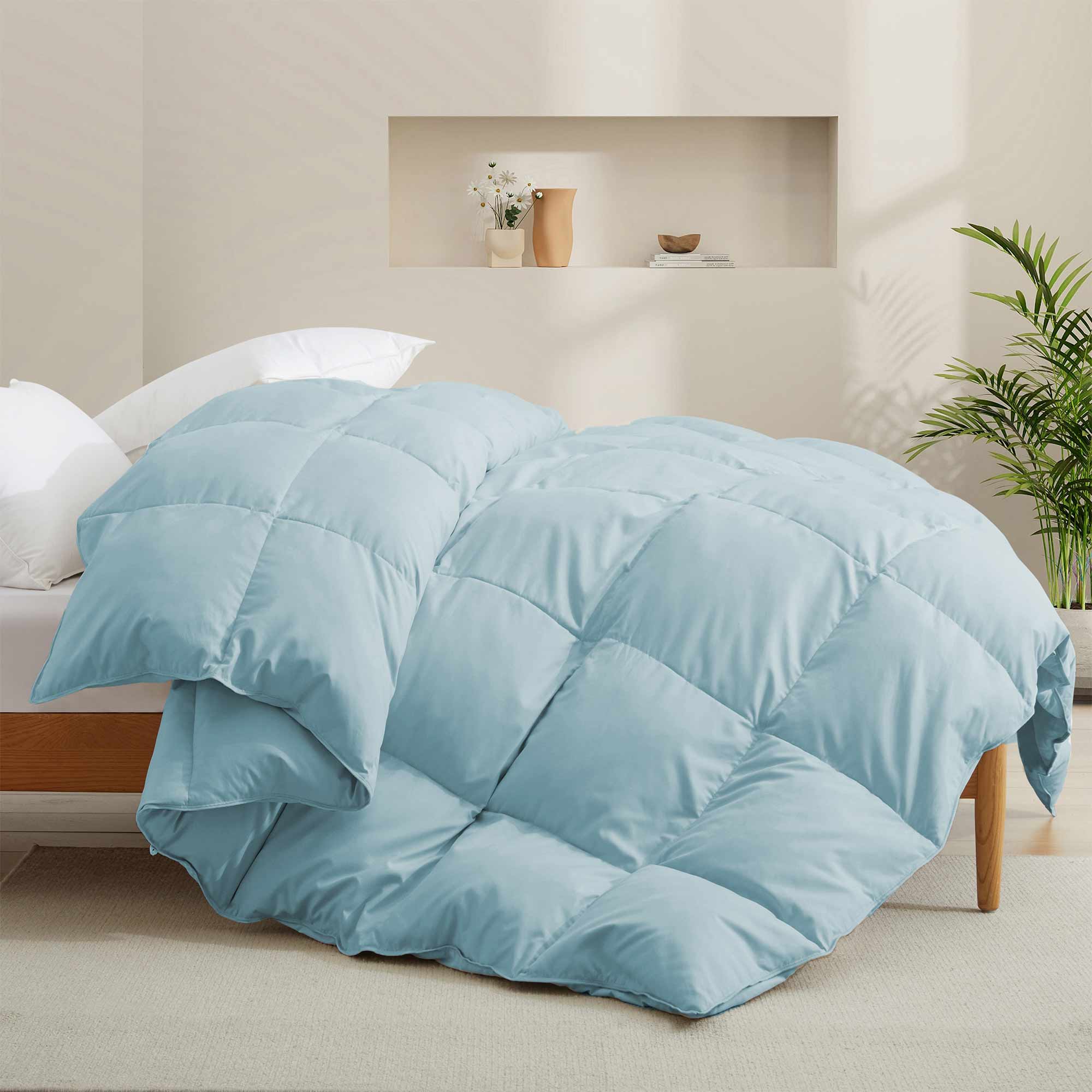 The down comforter with feathers is enveloped in the pristine shades of Sky Blue. Enjoy a cloud-like experience for a cozy sleep with this superior quality down feather comforter with duvet ties.