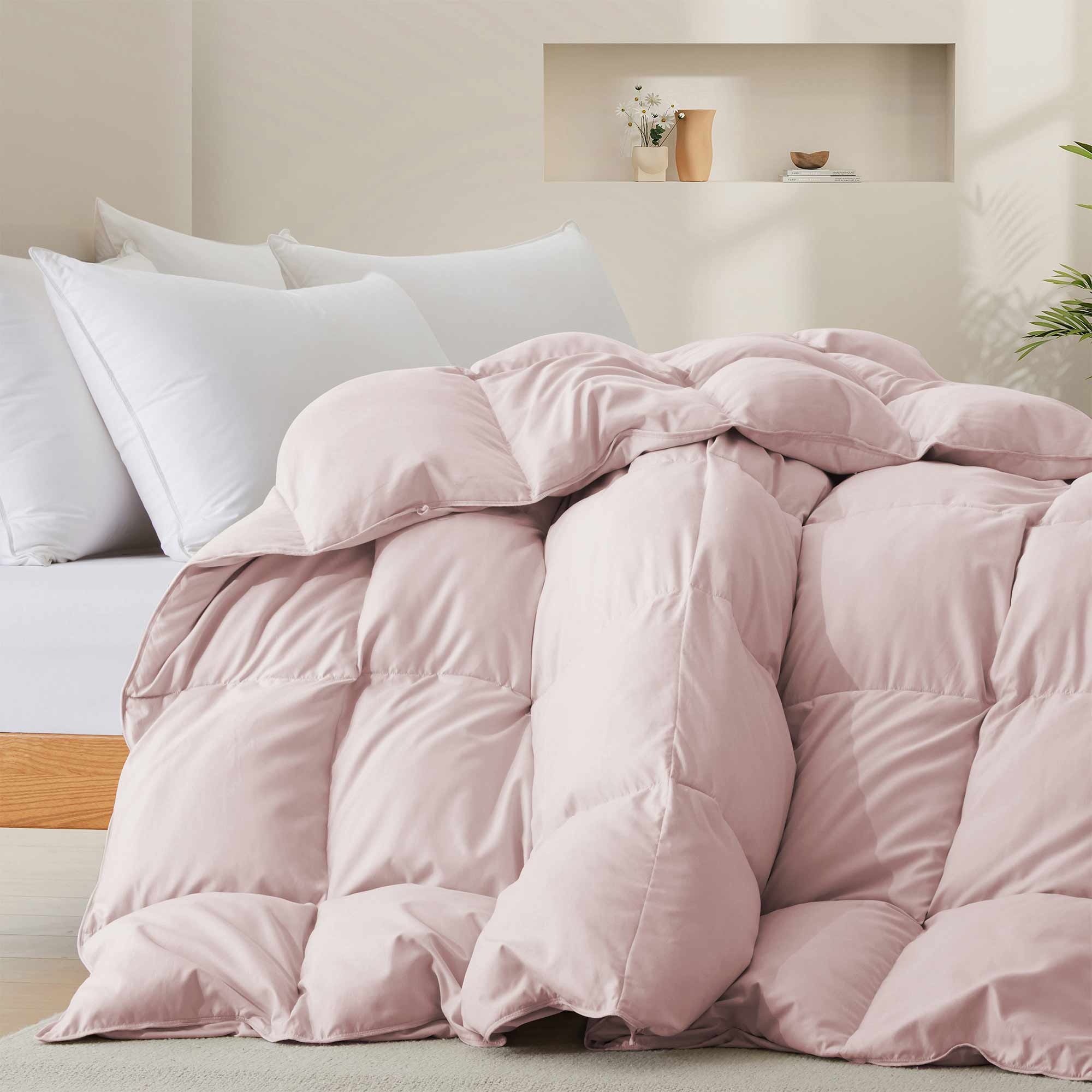 The feather goose down comforter is available in the feminine tones of Pink. Enjoy balanced year-round warmth with this feather goose down comforter.