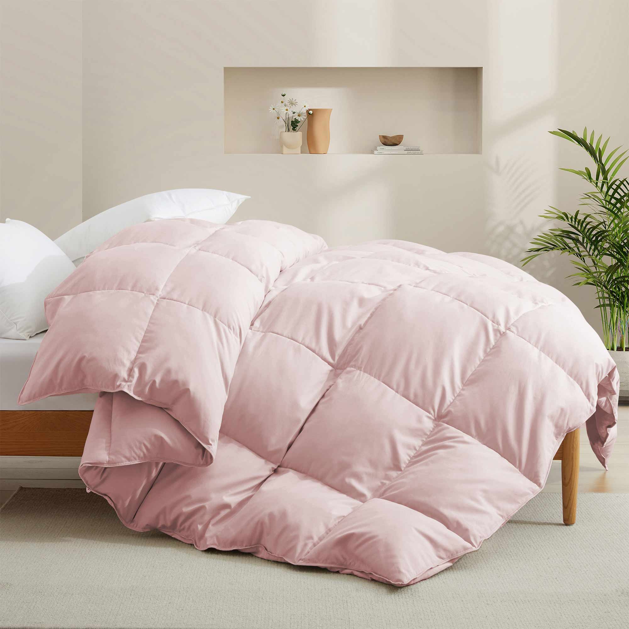 The feather goose down comforter is available in the feminine tones of Pink. Enjoy balanced year-round warmth with this feather goose down comforter.