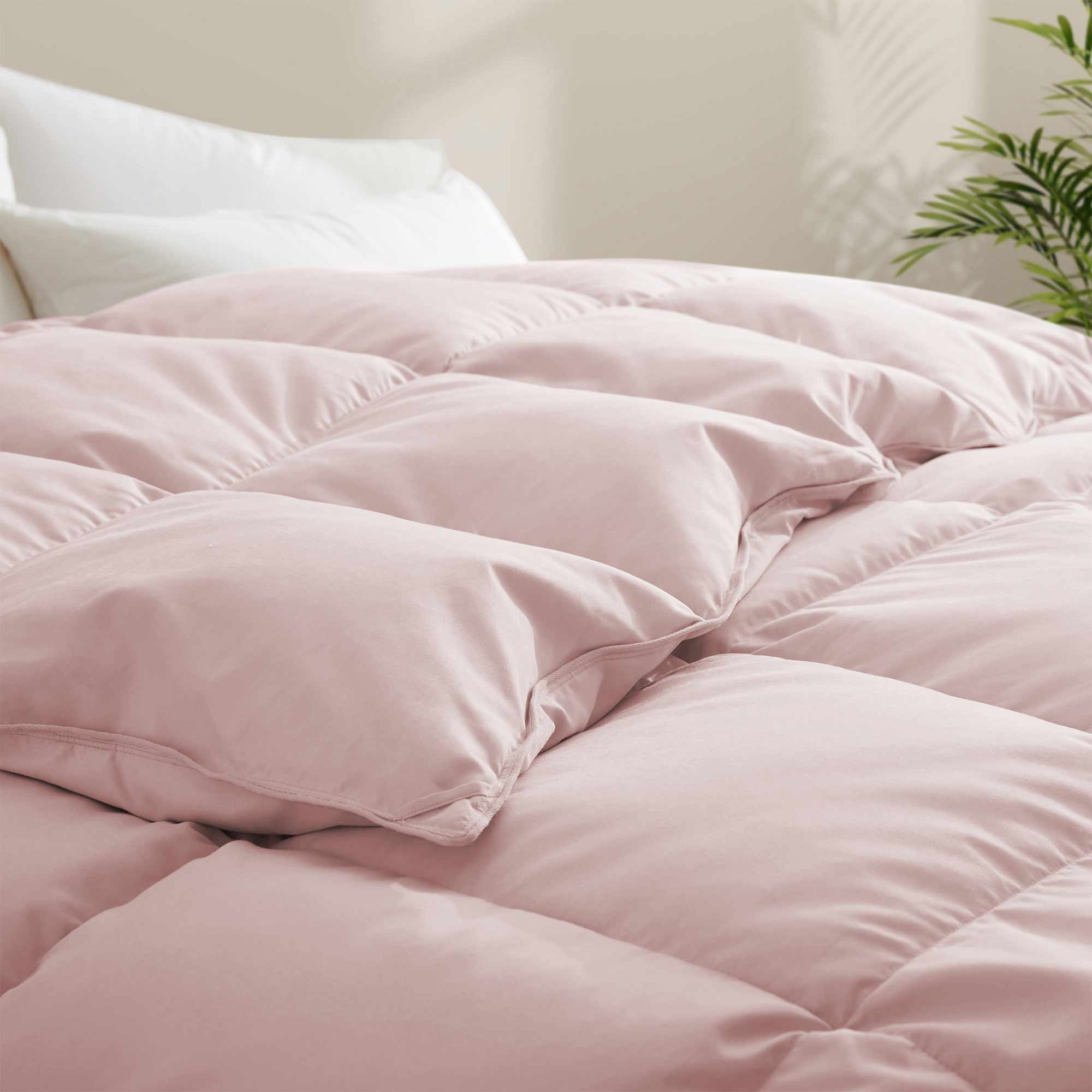 The feather goose down comforter is available in the feminine tones of Pink. Enjoy balanced year-round warmth with this feather goose down comforter.