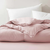 The feather goose down comforter is available in the feminine tones of Pink. Enjoy balanced year-round warmth with this feather goose down comforter.
