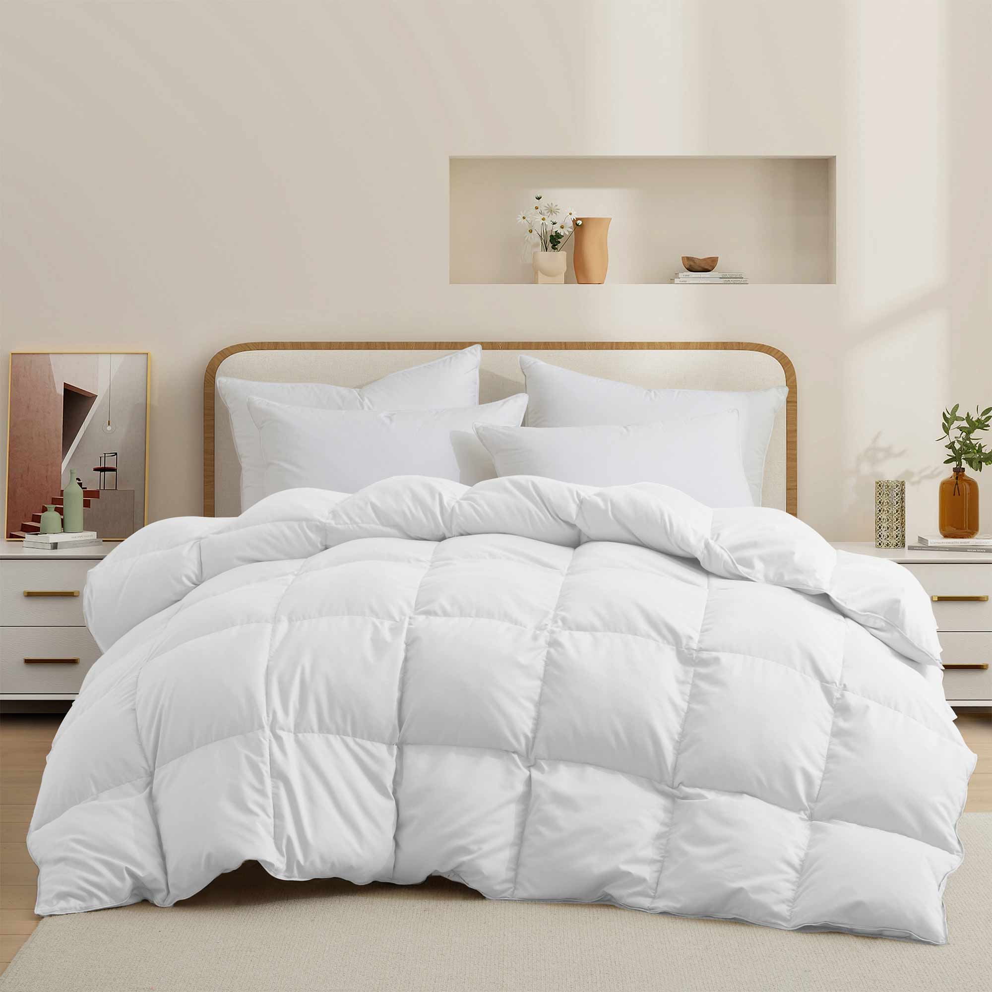 Fresh white tones are brushed over the all-size comforter. Add a touch of all-around luxurious warmth to your modern bedroom design with this down comforter with feathers.
