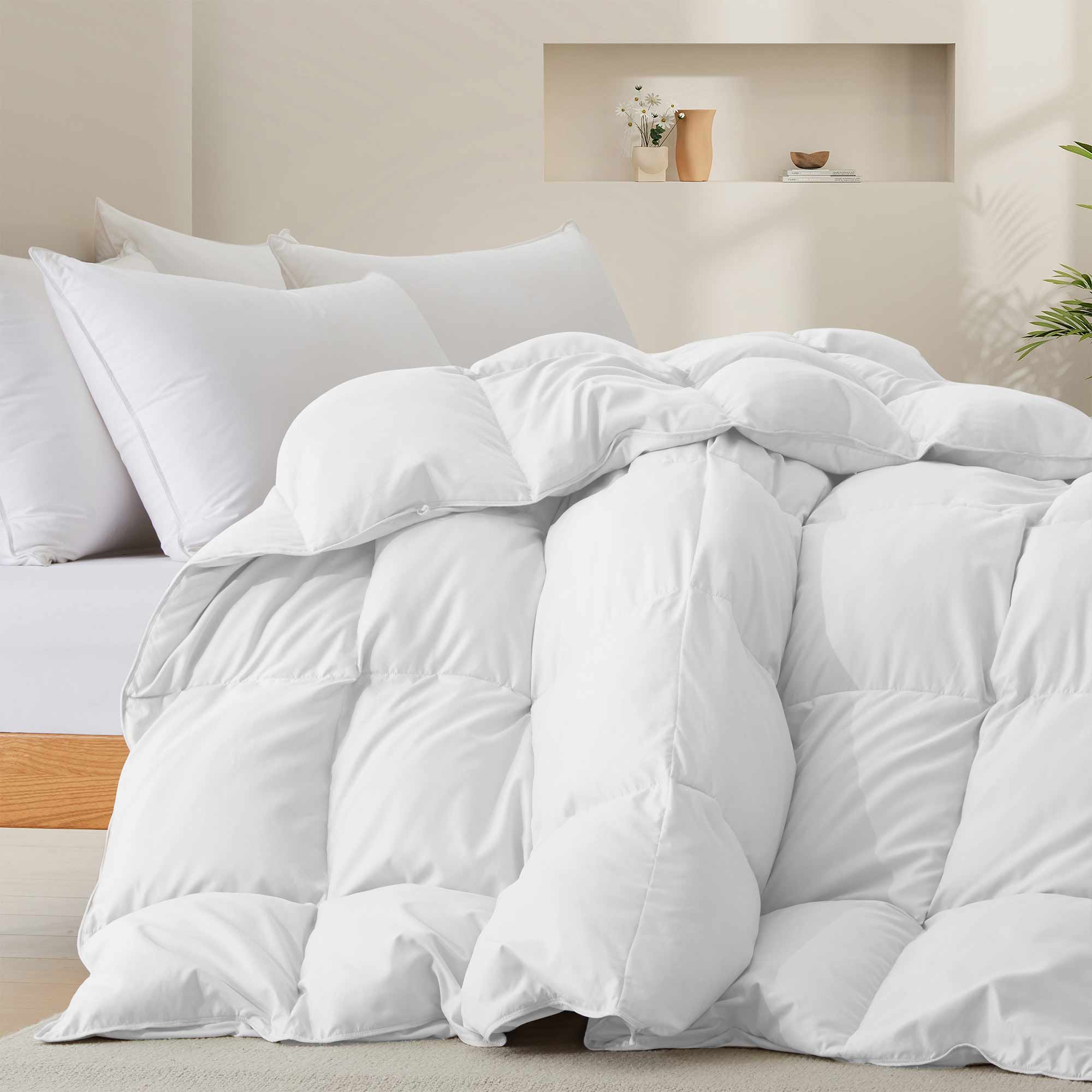 Fresh white tones are brushed over the all-size comforter. Add a touch of all-around luxurious warmth to your modern bedroom design with this down comforter with feathers.