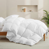 Fresh white tones are brushed over the all-size comforter. Add a touch of all-around luxurious warmth to your modern bedroom design with this down comforter with feathers.