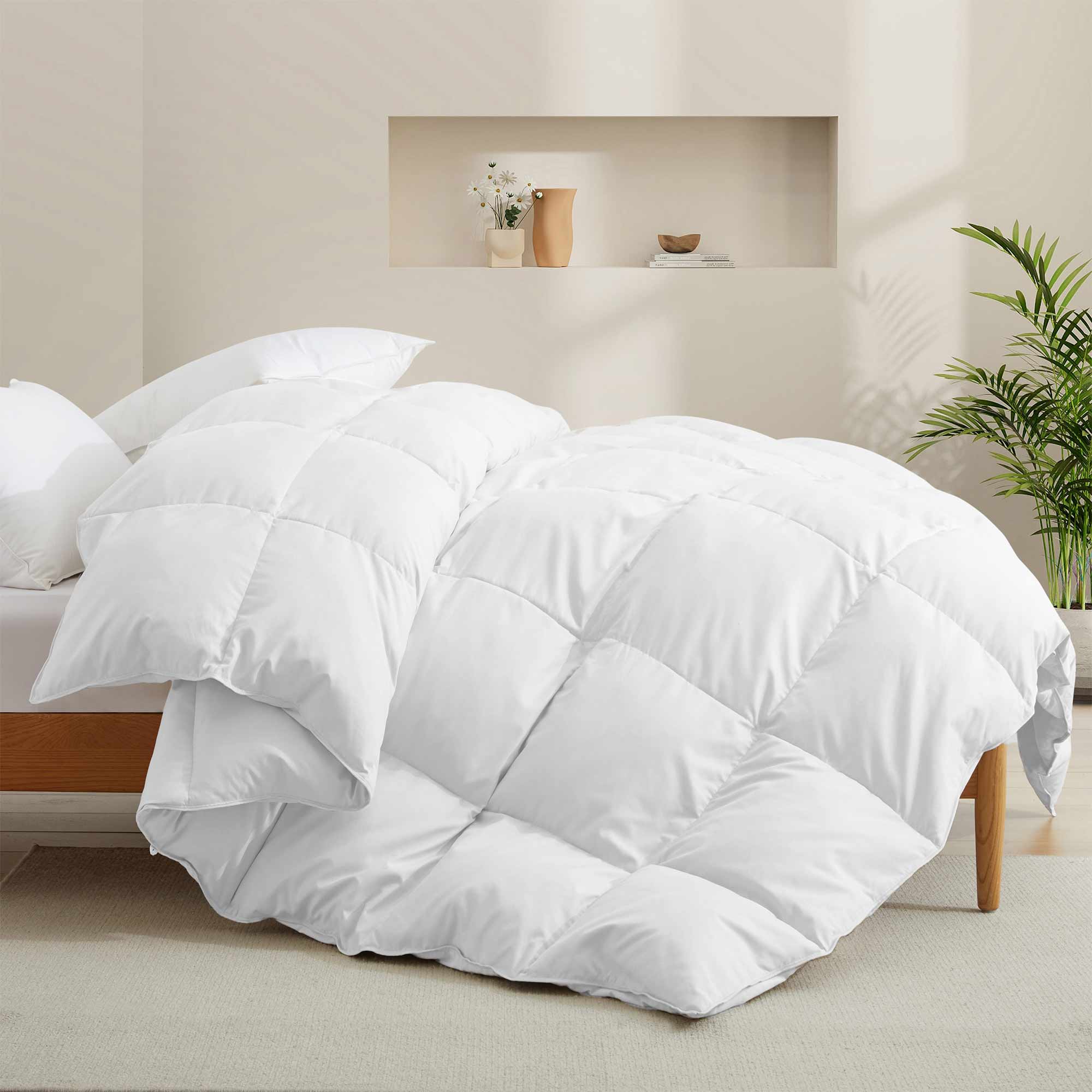 Fresh white tones are brushed over the all-size comforter. Add a touch of all-around luxurious warmth to your modern bedroom design with this down comforter with feathers.