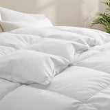 Fresh white tones are brushed over the all-size comforter. Add a touch of all-around luxurious warmth to your modern bedroom design with this down comforter with feathers.