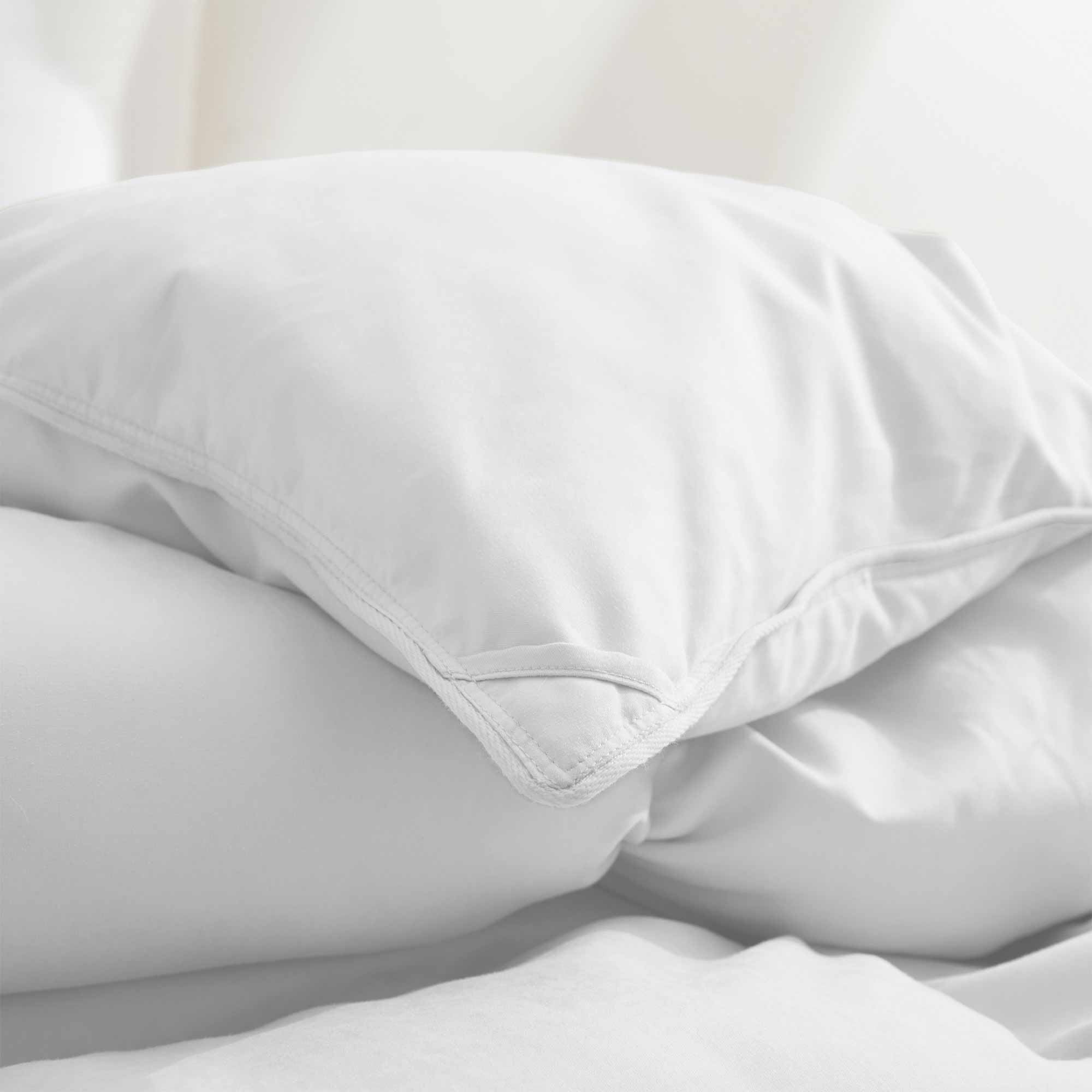 Fresh white tones are brushed over the all-size comforter. Add a touch of all-around luxurious warmth to your modern bedroom design with this down comforter with feathers.