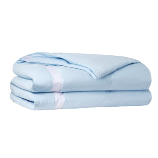 The luxurious comforter with corner tabs is enveloped in the cool tones of Sky Blue. Bring the icy cool freshness of the outdoors to your personal space with this feather down blanket.