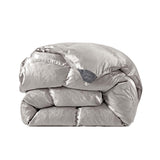 The comforter is covered in a brilliant silvery-gray shade and features soft damask patterns throughout that add a touch of texture to the fabric. Bring home the beauty of sophistication with this silk comforter.