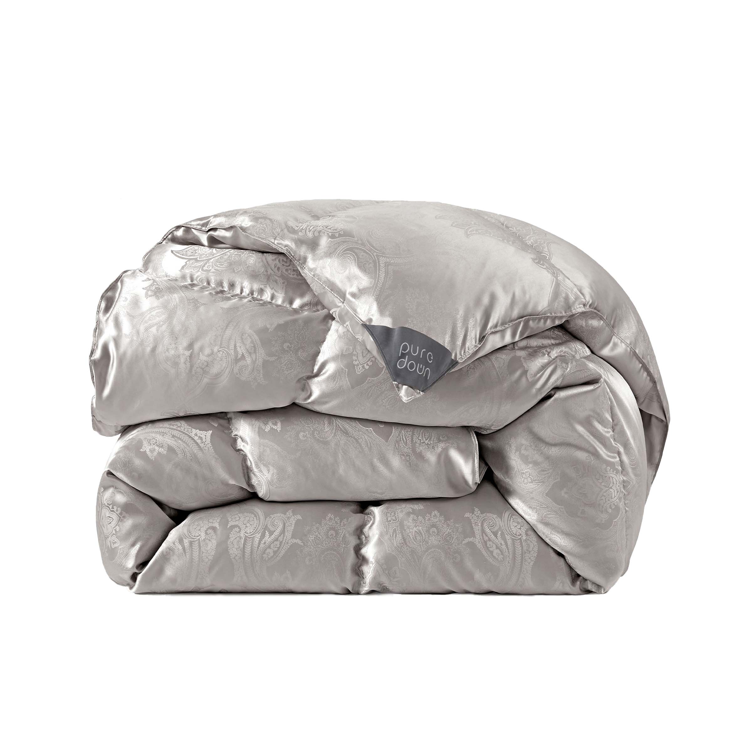 The comforter is covered in a brilliant silvery-gray shade and features soft damask patterns throughout that add a touch of texture to the fabric. Bring home the beauty of sophistication with this silk comforter.
