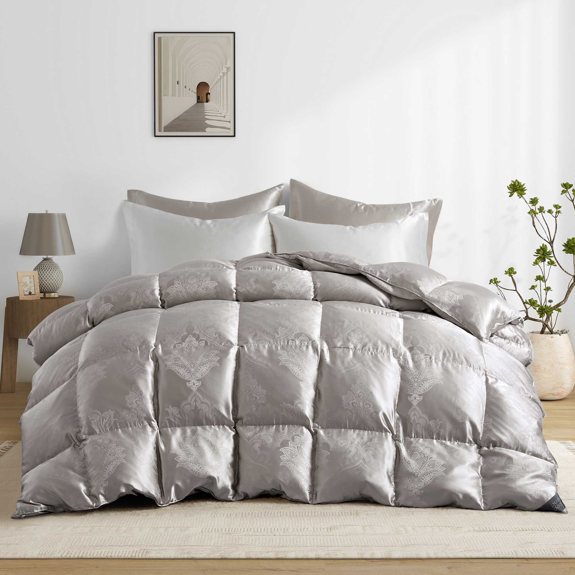 The comforter is covered in a brilliant silvery-gray shade and features soft damask patterns throughout that add a touch of texture to the fabric. Bring home the beauty of sophistication with this silk comforter.