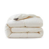 Crafted with a 100% organic cotton shell and filled with 90% natural white down, this comforter offers superior warmth and breathability. Its 800 fill power ensures a lightweight yet insulating sleep experience. Designed for year-round comfort, it features baffle box construction to maintain even fill distribution. Available in all-season and extra warm options, this comforter combines eco-friendly materials with luxurious softness for a restful night's sleep.
