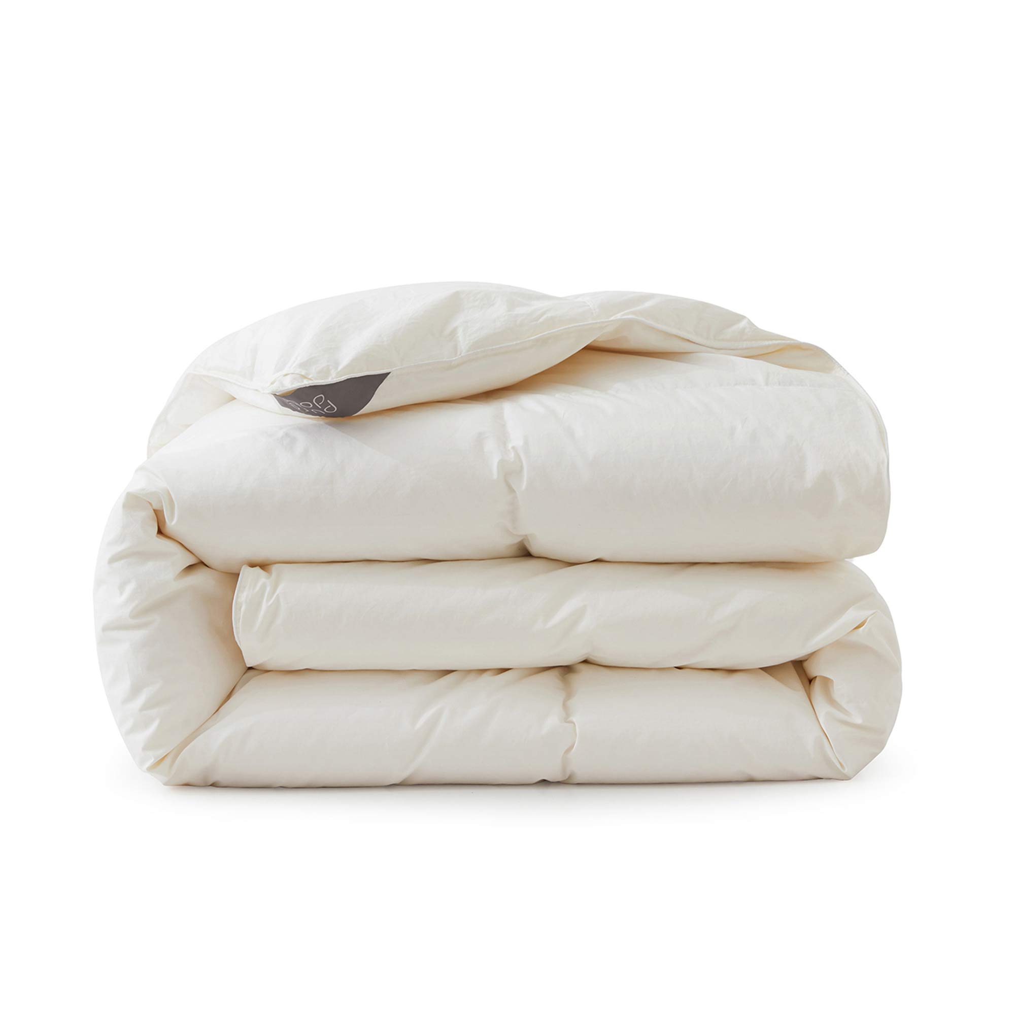 Crafted with a 100% organic cotton shell and filled with 90% natural white down, this comforter offers superior warmth and breathability. Its 800 fill power ensures a lightweight yet insulating sleep experience. Designed for year-round comfort, it features baffle box construction to maintain even fill distribution. Available in all-season and extra warm options, this comforter combines eco-friendly materials with luxurious softness for a restful night's sleep.