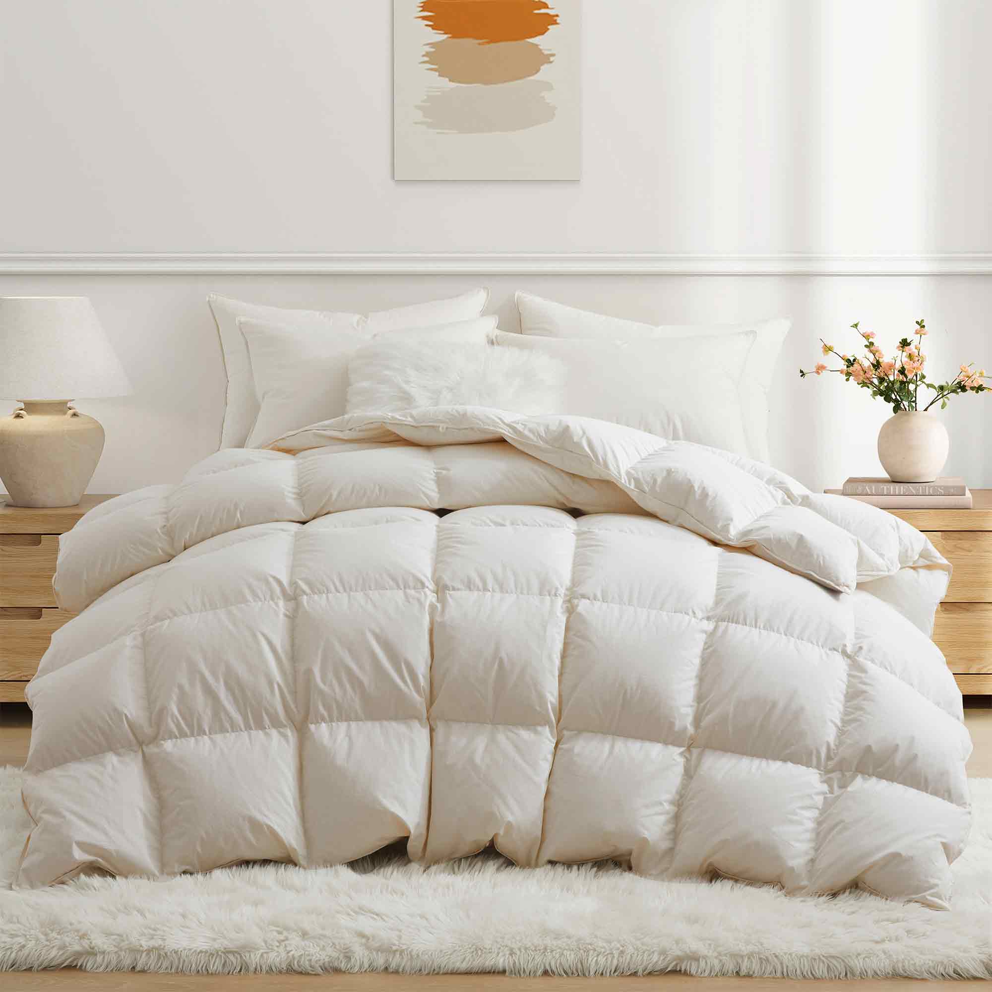 Crafted with a 100% organic cotton shell and filled with 90% natural white down, this comforter offers superior warmth and breathability. Its 800 fill power ensures a lightweight yet insulating sleep experience. Designed for year-round comfort, it features baffle box construction to maintain even fill distribution. Available in all-season and extra warm options, this comforter combines eco-friendly materials with luxurious softness for a restful night's sleep.