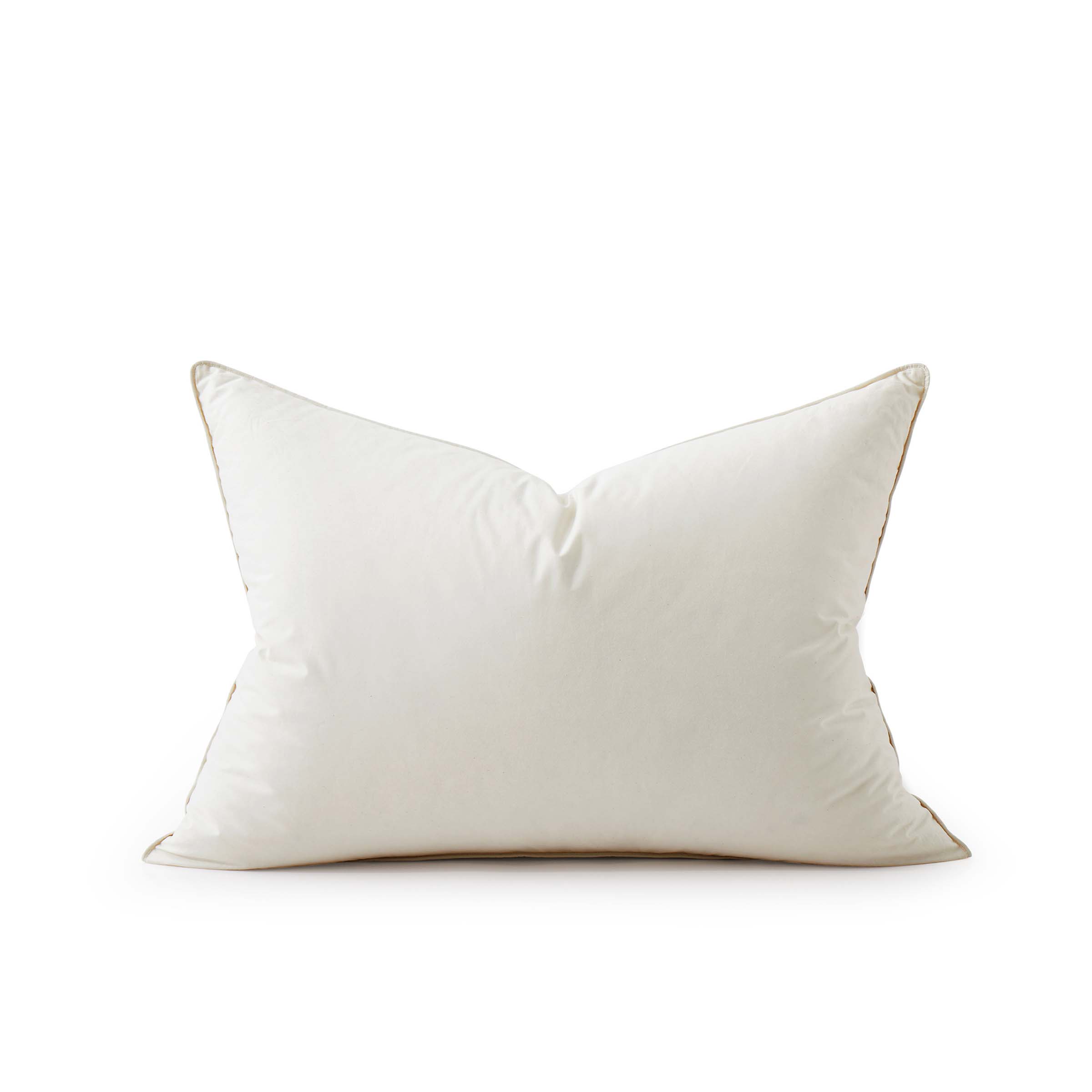 The fluffier pillow is covered in soft hues of off-white. Sink in the plush support and comfort of these best down pillows.