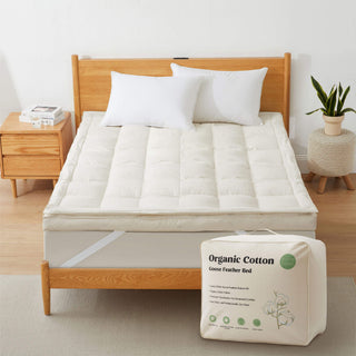 The plush surface of this feather blend mattress down topper is colored in pearly hues of off-white. Adding this feather mattress topper to your bedroom is an excellent choice for deep cushioning and additional comfort layer for a healthy sleep environment.