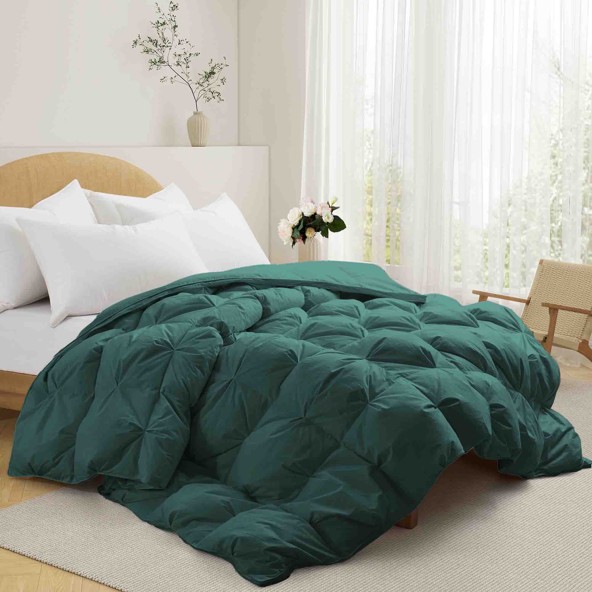 The down feather comforter is brushed in medium tones of forest green. Add a natural element to your bedroom style with this green color medium weight comforter.