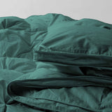 The down feather comforter is brushed in medium tones of forest green. Add a natural element to your bedroom style with this green color medium weight comforter.