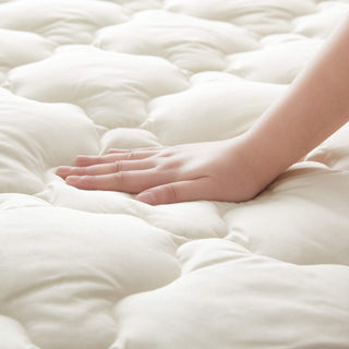 The waterproof protector is covered in the shades of natural material organic cotton or off-white tones. Enjoy extra comfort with this additional layer of comfort white mattress cover on your up to 15 inch deep mattress.