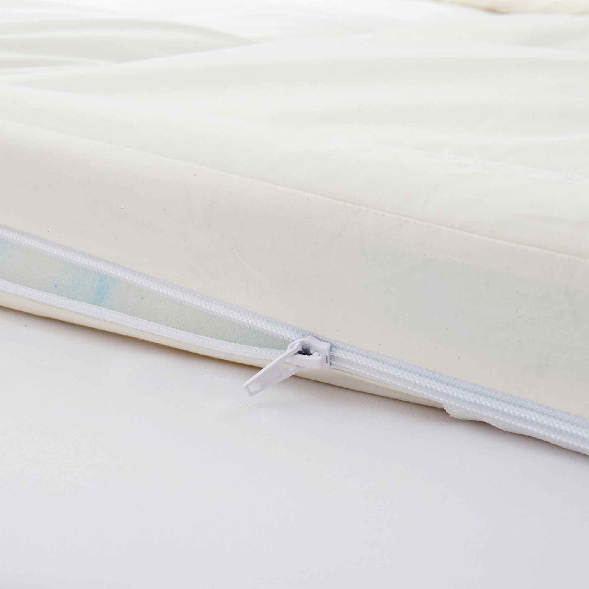 The organic cotton mattress encasement is covered in the serene tones of off-white. Turn your bedroom into a comfortable sleep environment with this washing machine friendly wash cover in off white.