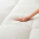 The organic cotton mattress encasement is covered in the serene tones of off-white. Turn your bedroom into a comfortable sleep environment with this washing machine friendly wash cover in off white.
