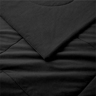 The down alternative comforter is enveloped in the bold shades of black. Sink into its velvety embrace and let your mind drift into a world of infinite possibilities with this box-stitching design comforter.