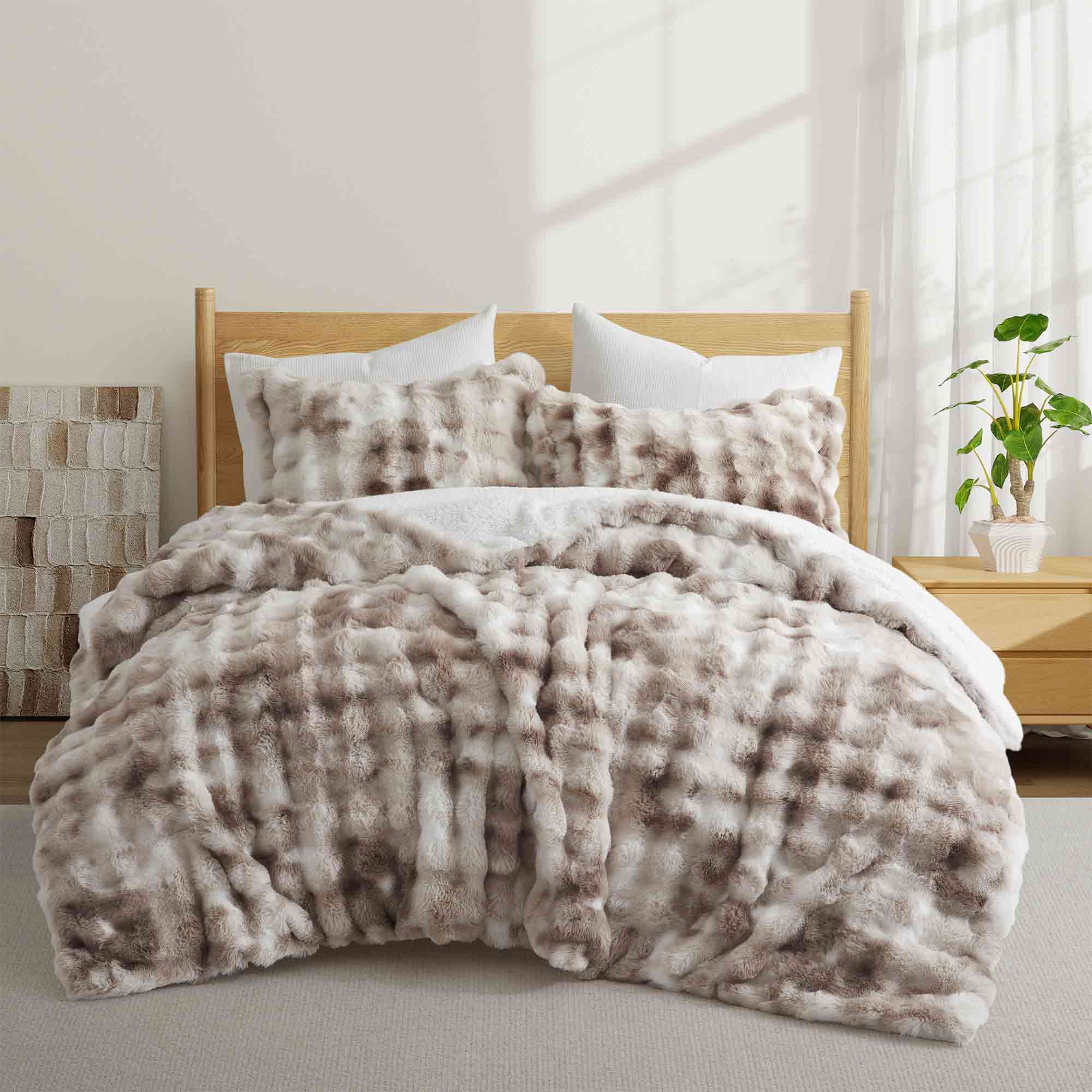 Soft Taupe offers cozy elegance for the cold season. This 3-piece reversible faux rabbit fur comforter set features an ultra-soft, velvety texture paired with a plush sherpa reverse, providing exceptional warmth and comfort during chilly nights. The soothing blend of beige and gray tones adds a touch of sophistication to any bedroom, making it the perfect choice for a stylish, snug winter retreat.