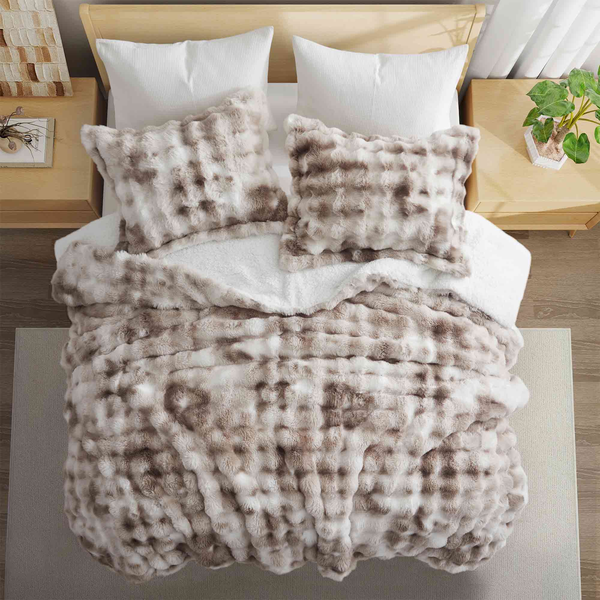 Soft Taupe offers cozy elegance for the cold season. This 3-piece reversible faux rabbit fur comforter set features an ultra-soft, velvety texture paired with a plush sherpa reverse, providing exceptional warmth and comfort during chilly nights. The soothing blend of beige and gray tones adds a touch of sophistication to any bedroom, making it the perfect choice for a stylish, snug winter retreat.